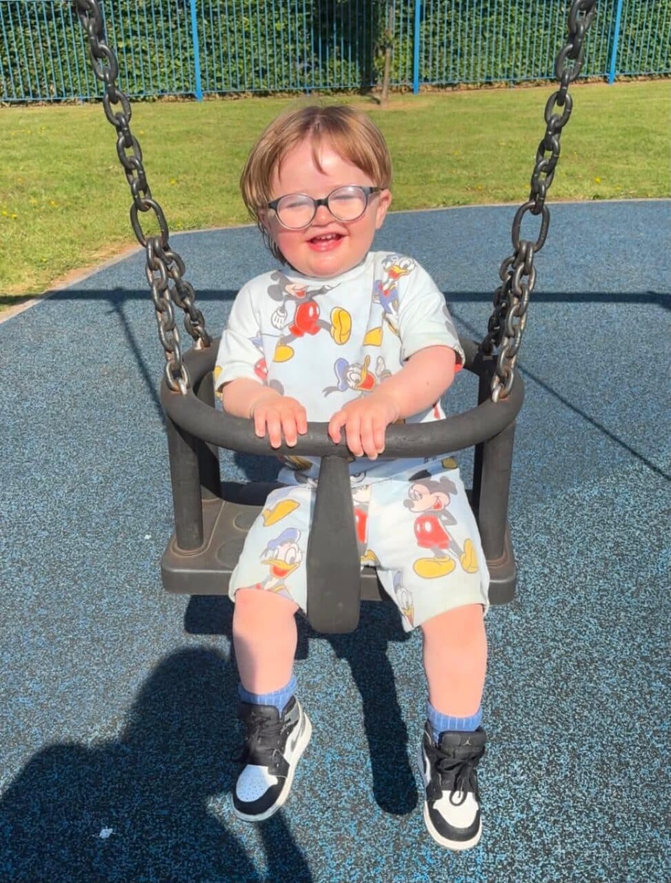 A child enjoying the park with their support worker